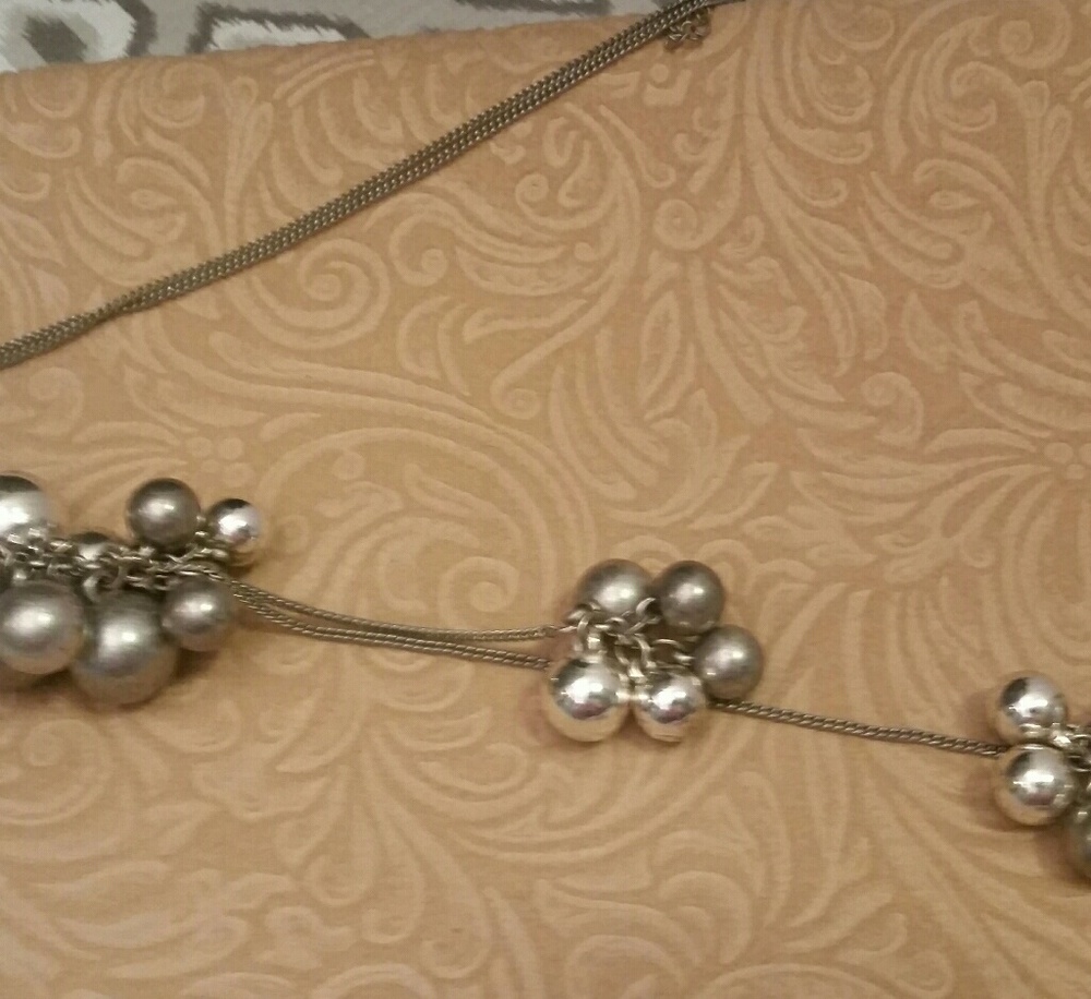 Silver tone necklace with shiny and matte balls